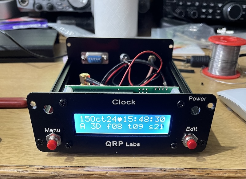 A GPS locked clock from QRP Labs showing the current date and time plus satellite statistics